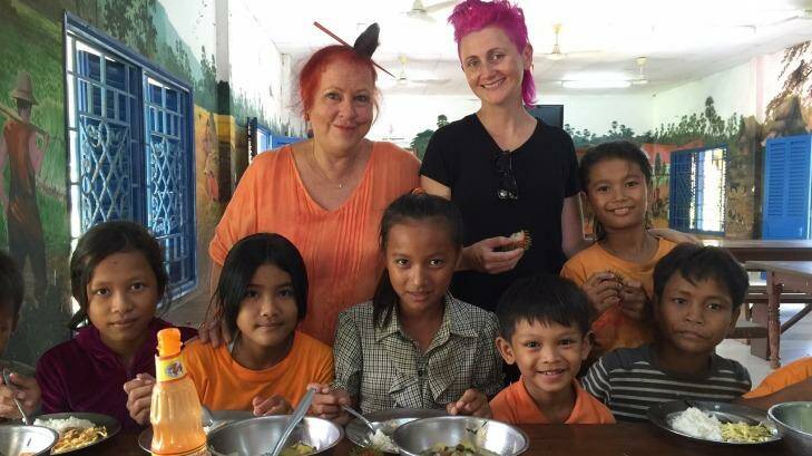 Geraldine Cox (left) and Lucy Perry with children at Sunrise Cambodia's orphanage on the outskirts of Phnom Penh.  Photo: Lindsay Murdoch