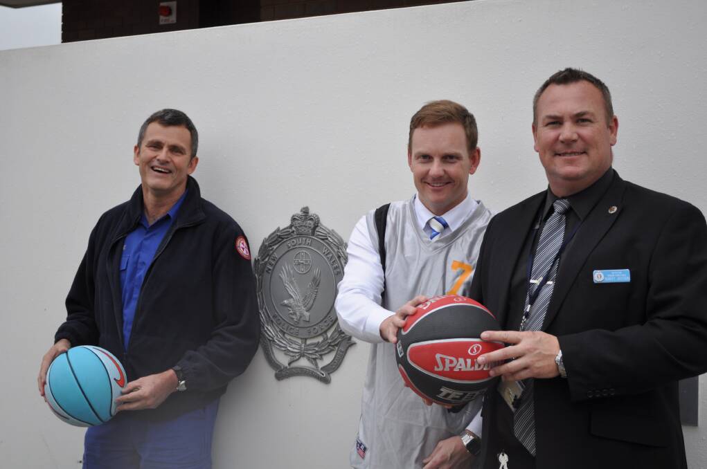 Ambulance officer Peter Daly with detectives Simon Thorsteinsson and Robert Jackson ahead of Saturday night's epic basketball match between teams from the two emergency service groups. 										   Photo: BEN WALKER