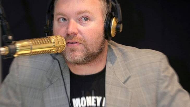 Kyle Sandilands with his gold microphone.