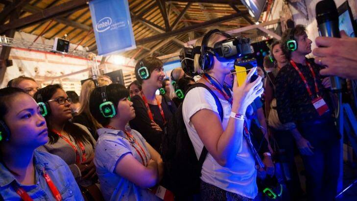 Visitors sample technologies in the Intel pavilion at the Tel Aviv DLD Innovation Festival. Photo: Miriam Alster/Flash90