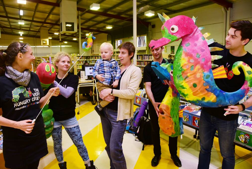 Puppeteers Justine Warner, Dannielle Jackson, Rory Kelly and Drew Wilson from The Very Hungry caterpillar Show entertain Elizabeth Duggan and two-year-old Flynn Duggan.								   
Photo: BELINDA SOOLE