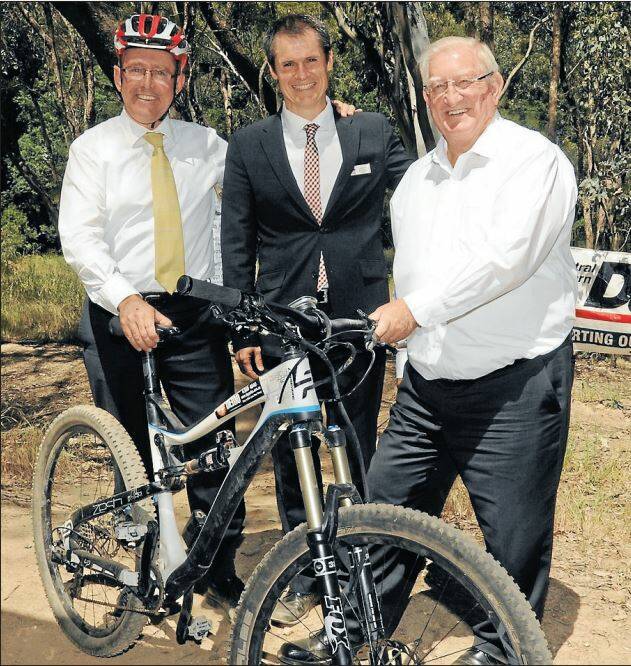 Dubbo mayor Mathew Dickerson (centre), pictured with Central Western Daily managing editor Tony Rhead and Orange mayor John Davis, has declared the opening round of the Fairfax Media Evocities MTB Series a success. Photo: STEVE GOSCH