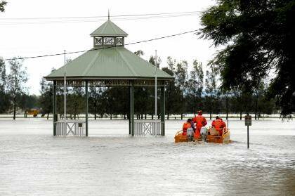 State Emergency Service crew set off in a flood boat to help residents in Raymond Terrace. Photo: Ryan Osland