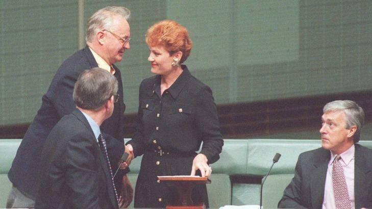 Pauline Hanson is congratulated after her maiden speech by fellow Independents. Photo: Andrew Meares