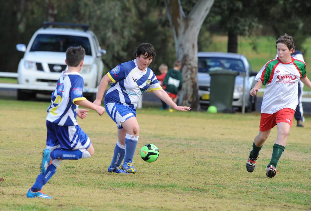 Ben Walsh aims to dribble his way up the field.