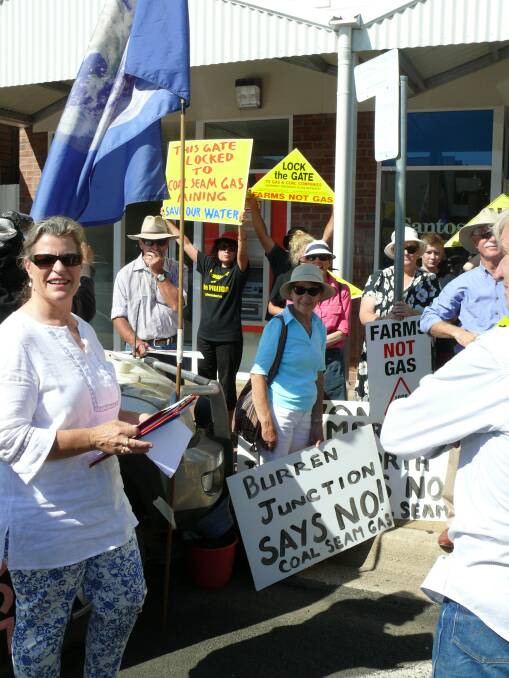 Megan Kuhn (front left) with protesters outside the Santos office at Narrabri. 
Photo: RON CAMPEY