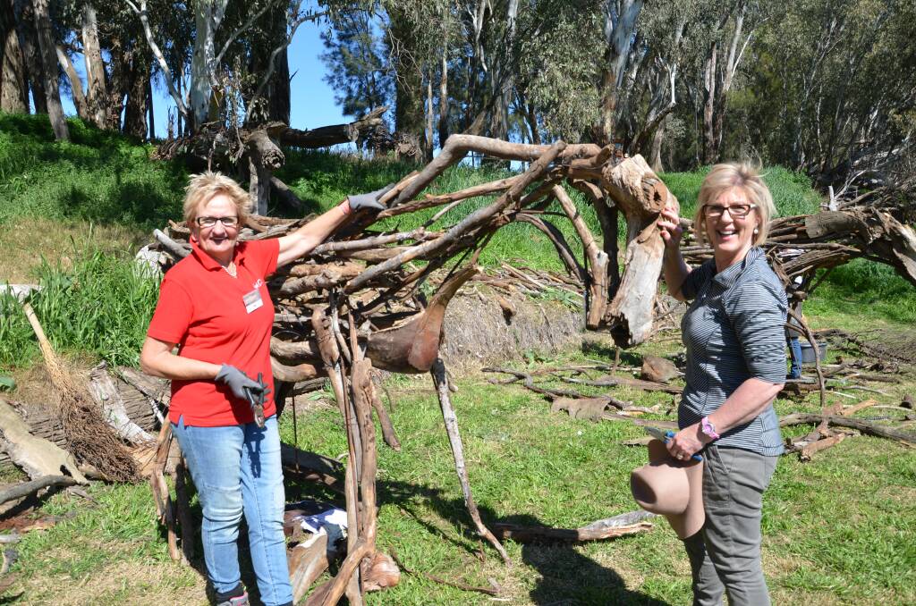 Pam Urquhart and Anne Gemmell constructing Horsome at Sculptures by the River. Photo: JENNIFER HOAR