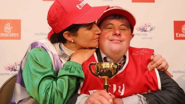 Michelle Payne celebrates her winning ride with brother and strapper Stevie Payne. Photo: Michael Dodge