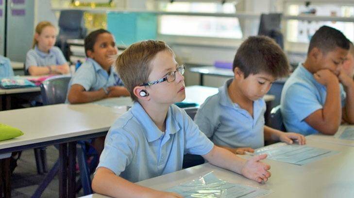 Perth school boy Kai finds it easier to concentrate on the teacher's voice with Nuheara's IQbuds helping to compensate for his Auditory Processing Disorder. Photo: Supplied