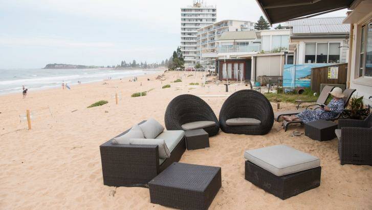 Residents at Collaroy make do after the June east coast low wiped out their swimming pool (buried beneath the sand). Photo: James Brickwood