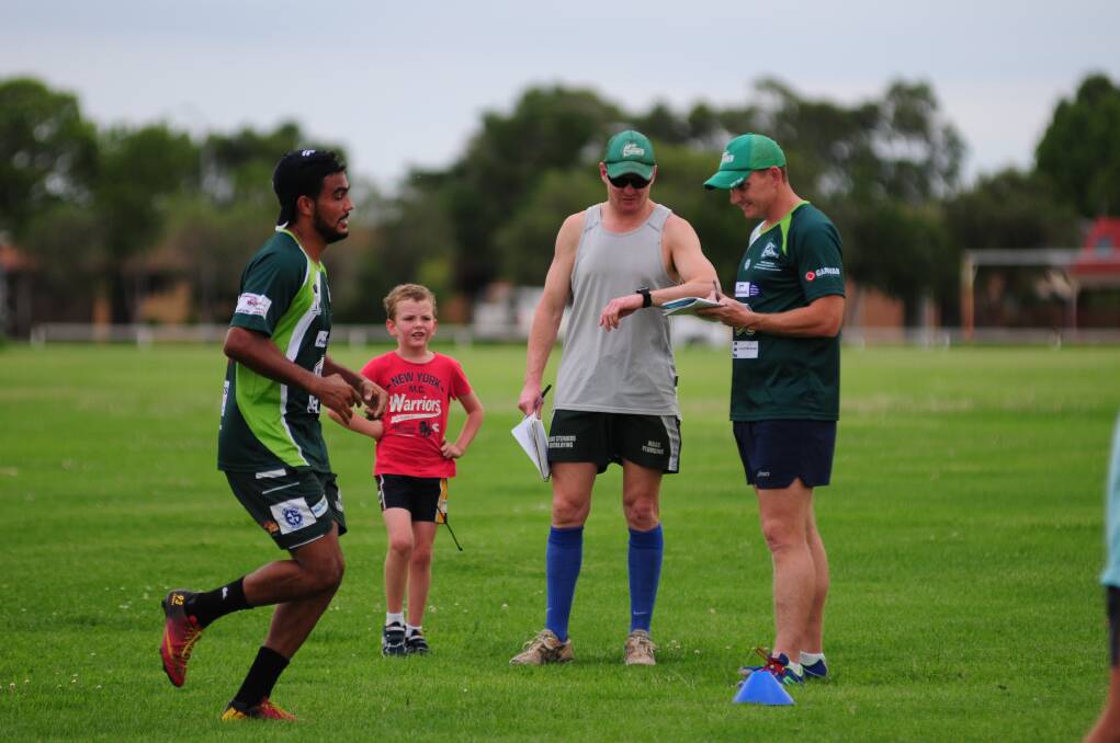 CYMS player Keiran Shipp's running is timed by coach Tim Ryan and trainer Simon Thorsteinsson.