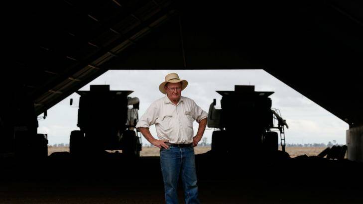 Farmer Michael O'Brien with harvesters he has not used for years because of the drought. Photo: Peter Rae
