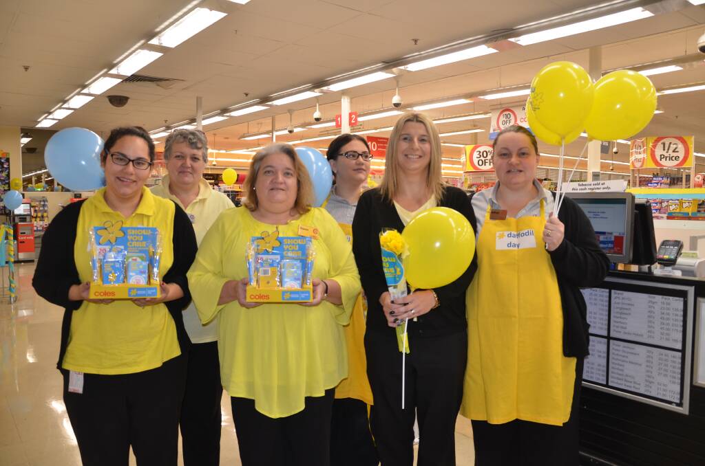 Coles Dubbo Square staff Kim Warman, Brittany Hill, Grace Brown, Sharon Cusack, Julie McDougall and Kathryn Thorne embraced Daffodil Day in aid of Cancer Council Australia.      Photo: JENNIFER HOAR