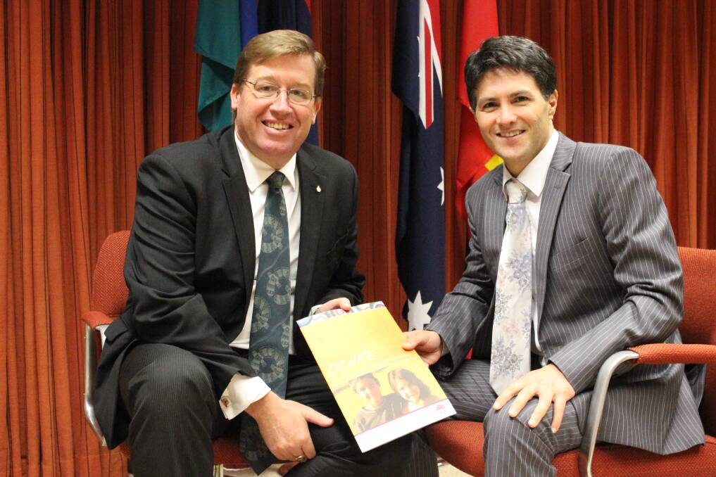 State Member for Dubbo Troy Grant confers with NSW Minister for Aboriginal Affairs Victor Dominello before making his speech in the Wiradjuri and English languages. 	Photo: contributed
