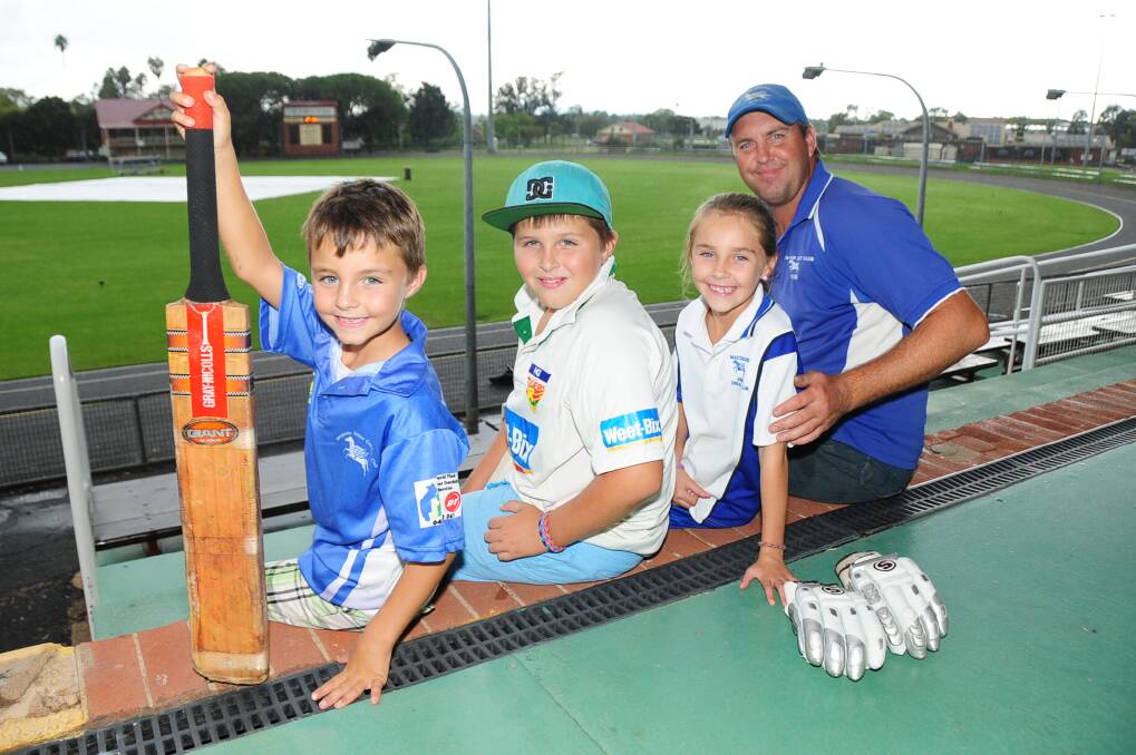 Kyan, Cody and Nalani Green with their dad Jason as he prepares for his first grand final in 25 years of senior cricket at Dubbo. 	Photo: Belinda Soole
