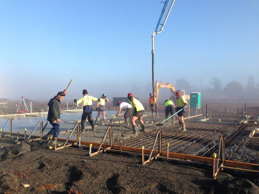 Crews work on a concrete pour as part of the construction of a $20 million aged care facility within the Dubbo Masonic Village site.