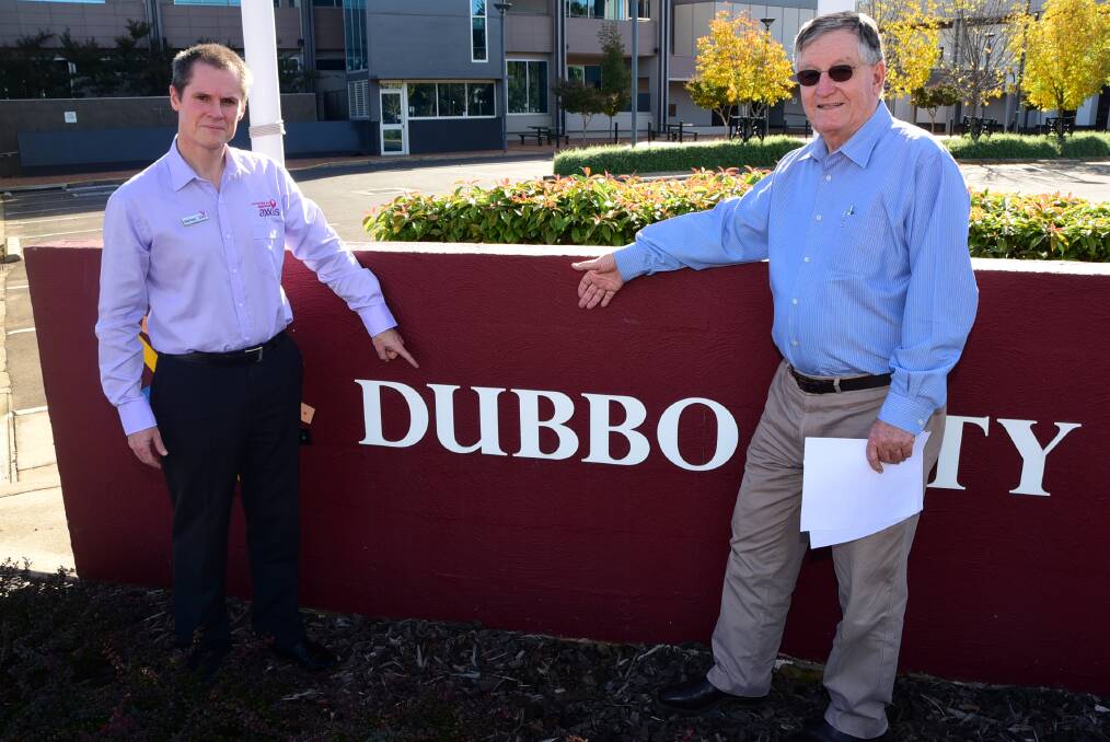 Former Dubbo mayor Mathew Dickerson and Real Estate Institute of NSW - Orana division chairman Bob Berry highlight the importance of the 'Dubbo City Council' name. Photo: BROOK KELLEHEAR-SMITH