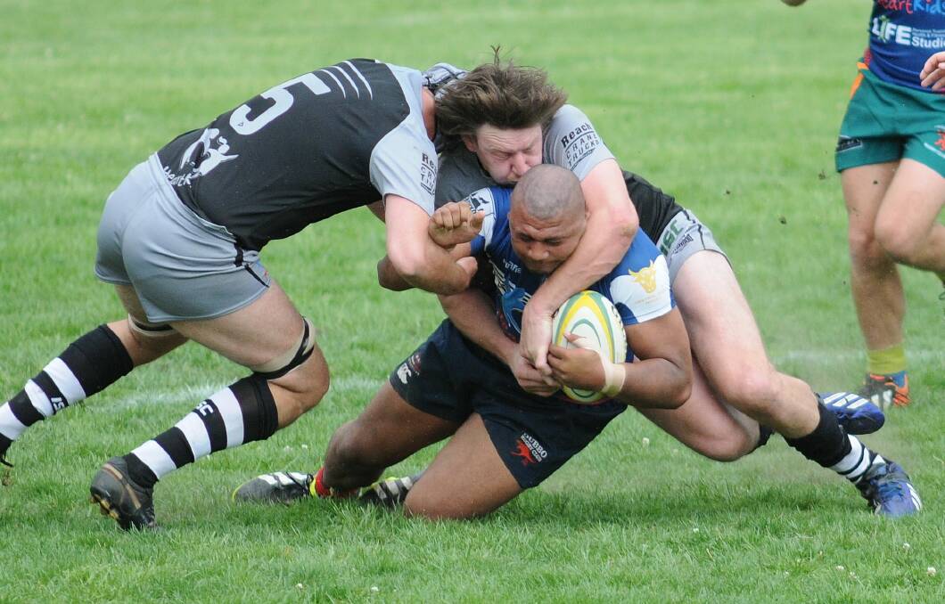 Dubbo s Max Ma a Nelson is brought down by the Deadwood defence on Saturday. 	 Photo: Steve Gosch