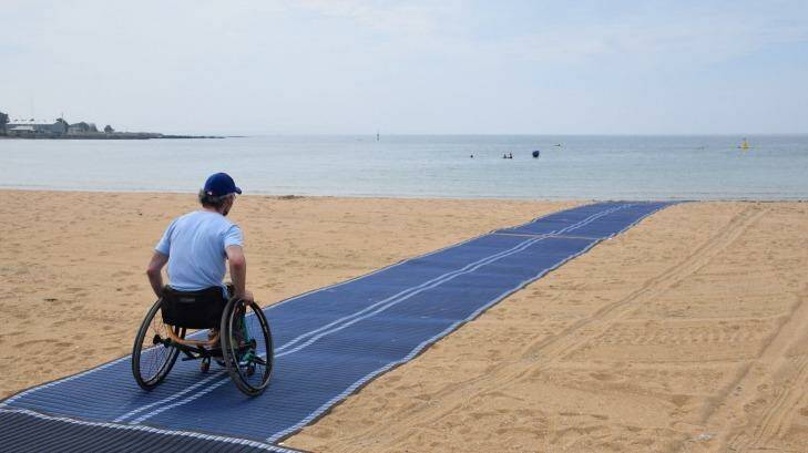 Brook Quinn tests the wheelchair-accessible matting at Williamstown Beach. Photo: Supplied