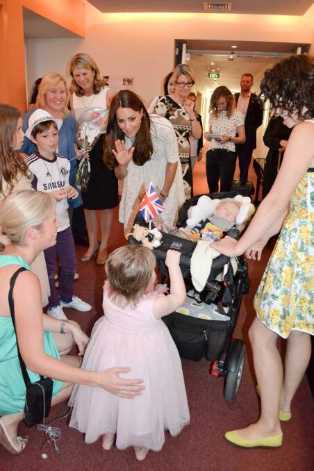 Baby Max McIntyre is pushed around his pram by a little friend at Bear Cottage, watched on by the Duchess of Cambridge.