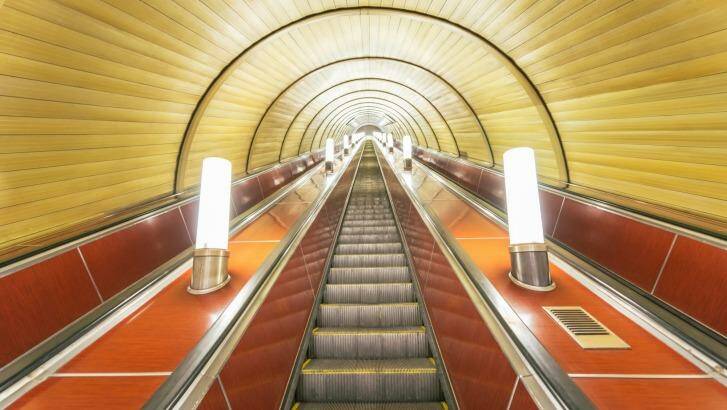 Soviet Union style architecture: The escalator in the Metro, Subway of Moscow, Russia. Photo: Mlenny