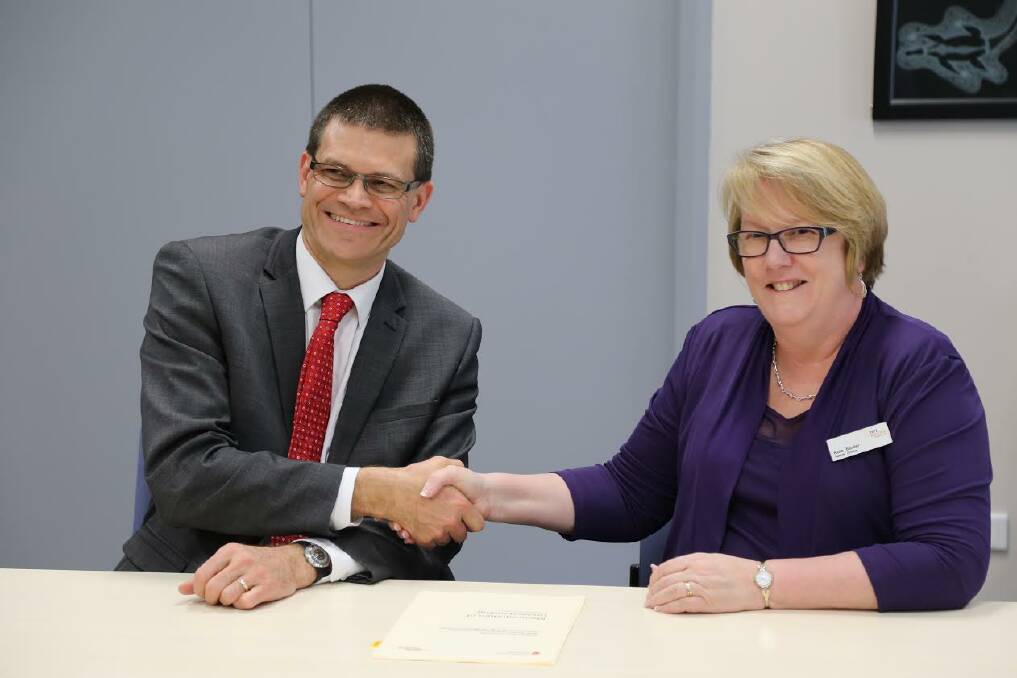 CSU Vice-Chancellor Professor Andrew Vann and TAFE Western s Institute Director Kate Baxter.	Photo: CONTRIBUTED