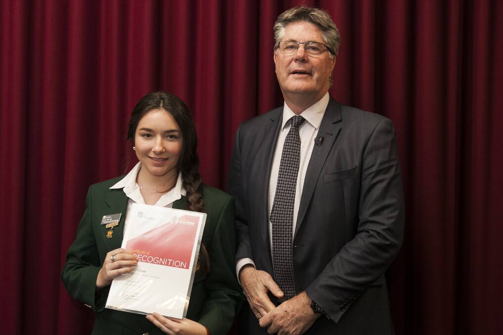 Warren Central School student Emily Glover receives a certificate of recognition from the NSW Department of Education's deputy secretary schools Greg Prior. 				       Photo: Contributed