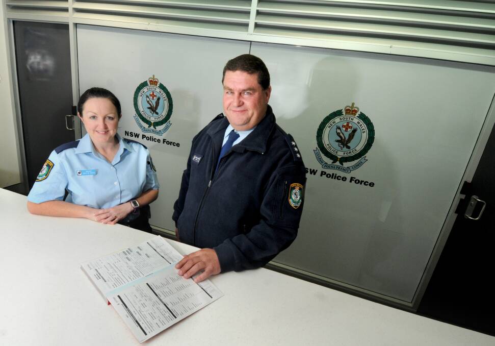 Dubbo's newest police recruit, Probationary Constable Cristin McGee, is shown the ropes by seasoned duty officer Acting Inspector Richard Morley.
