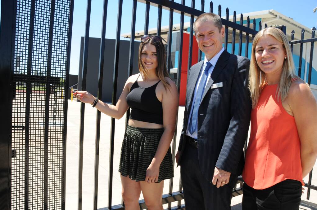 Payton Smede is presented with her access key to Barden Park by Dubbo mayor Mathew Dickerson and Dubbo City Council's manager of recreational planning and programs, Tracey Whillock.