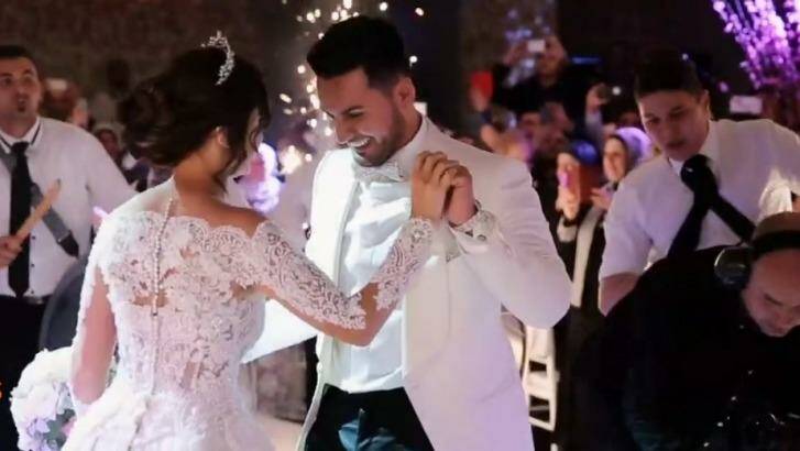 Salim Mehajer and his wife Aysha dance in a screenshot of the video from the garish wedding reception. Photo: Supplied