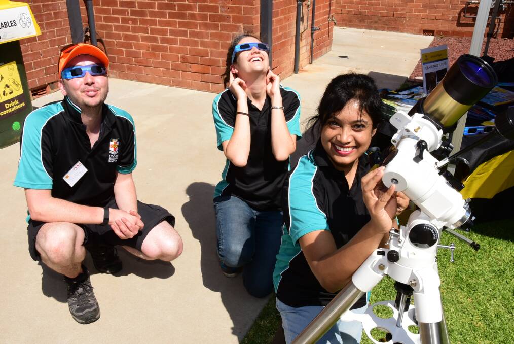 Shane Hengst, Laura Wade and Shaila Akhter from the University of NSW school of physics get kids to look to the skies. 															 Photo: BROOK KELLEHEAR-SMITH