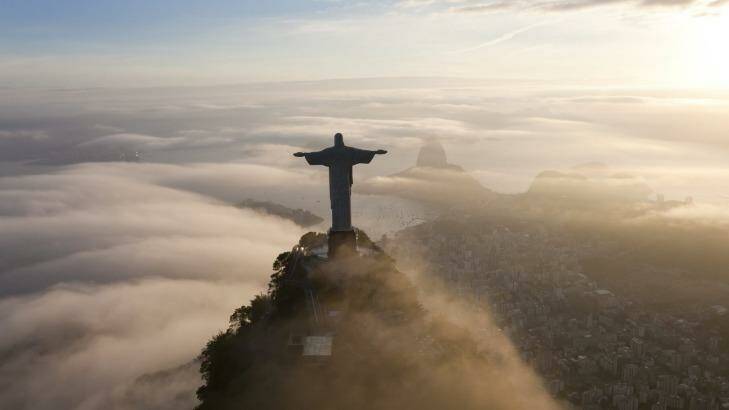 The statue of Christ the Redeemer stands like a guardian angel over the city. Photo: Peter Adams