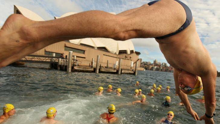 Wet and wild: The annual Australia Day Ocean Swim in which professional and amateur swimmers alike compete in a race around the harbour.
 Photo: Jacky Ghossein