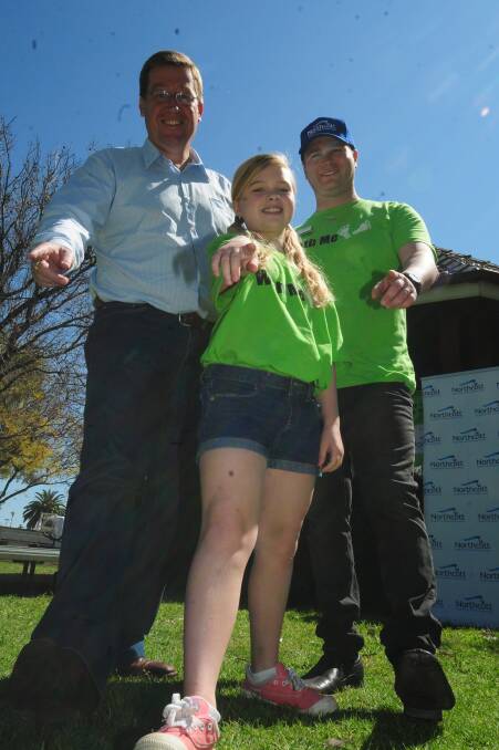 Troy Grant, Arleia and Cameron Luckie at the Walk With Me fun day. 		      Photo: GREG KEEN