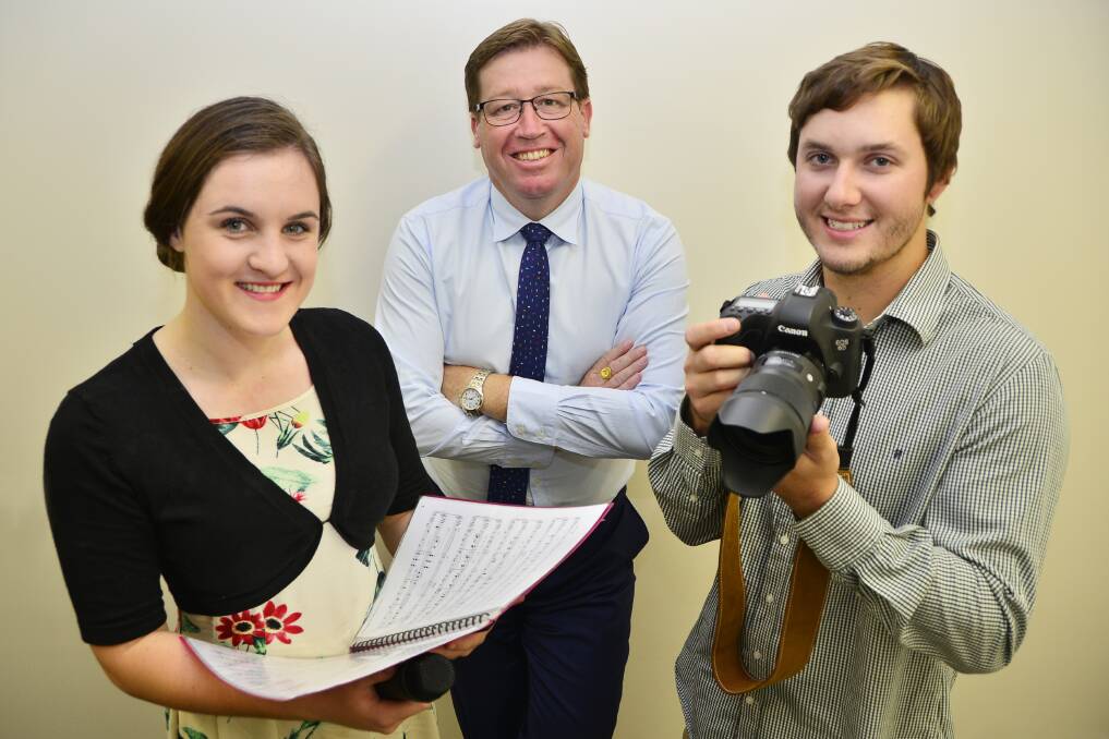 Young Regional Artist Scholarship recipients Billie Palin and Brook Kellehear-Smith (right) tell NSW Arts Minister and state Member for Dubbo Troy Grant how they will use them to pursue their careers.								         Photo: BELINDA SOOLE