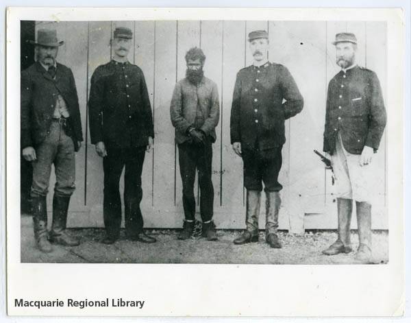 Jacky Underwood photographed with police officers in 1900. PHOTO MACQUARIE REGIONAL LIBRARY