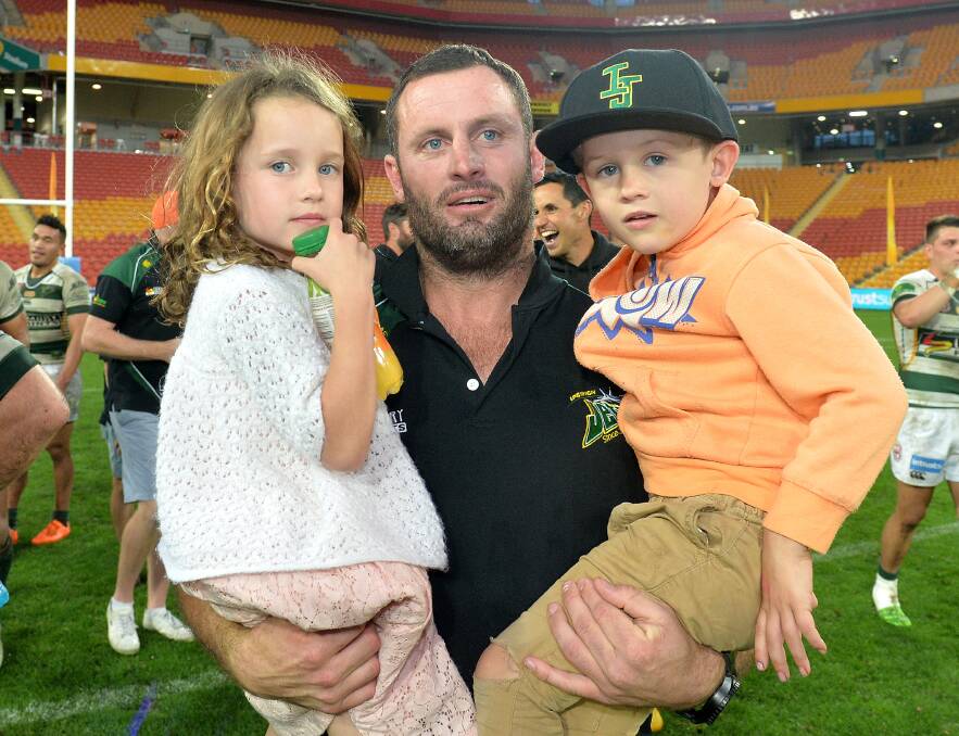 Former NRL star Chris Walker, pictured last year with his two children, is sure to be a hit at Peak Hill this weekend. 		  Photo: GETTY IMAGES