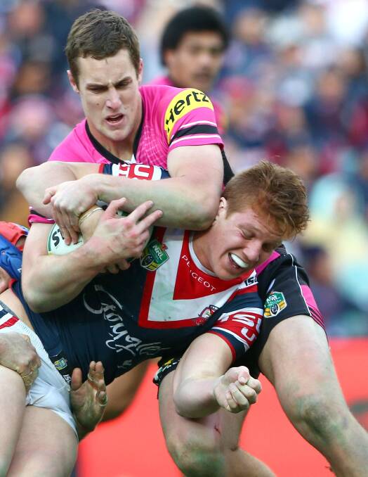 SYDNEY, AUSTRALIA - JULY 19:  Dylan Napa of the Roosters is tackled by Isaah Yeo during the round 19 NRL match between the Sydney Roosters and the Penrith Panthers at Allianz Stadium on July 19, 2014 in Sydney, Australia.  (Photo by Renee McKay/Getty Images) Isaah yeo, nrl 2014. pictures: getty images