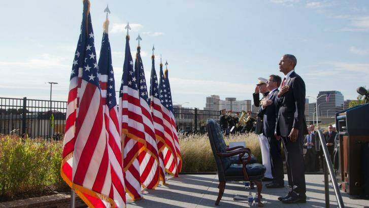 President Barack Obama with Defense Secretary Ash Carter and Chairman of the Joint Chiefs of Staff Gen. Joseph Dunford, stand as the national anthem is played during a memorial observance ceremony at the Pentagon, Sunday, Sept. 11, 2016. Photo: Manuel Balce Ceneta