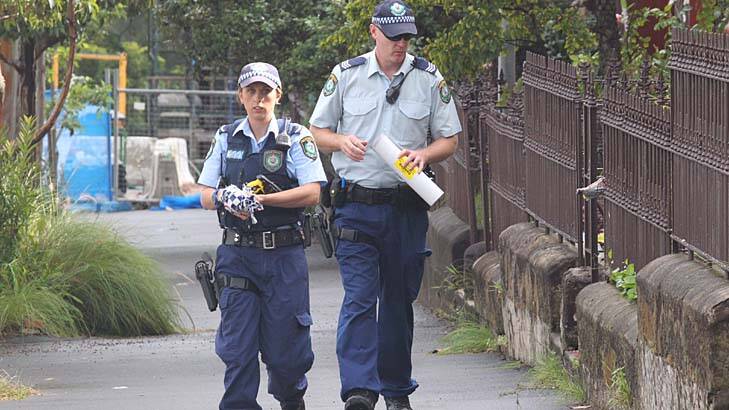 Police look for clues after a father and sone were shot in Jones Street, Pyrmont, on Sunday night. Photo: Peter Rae