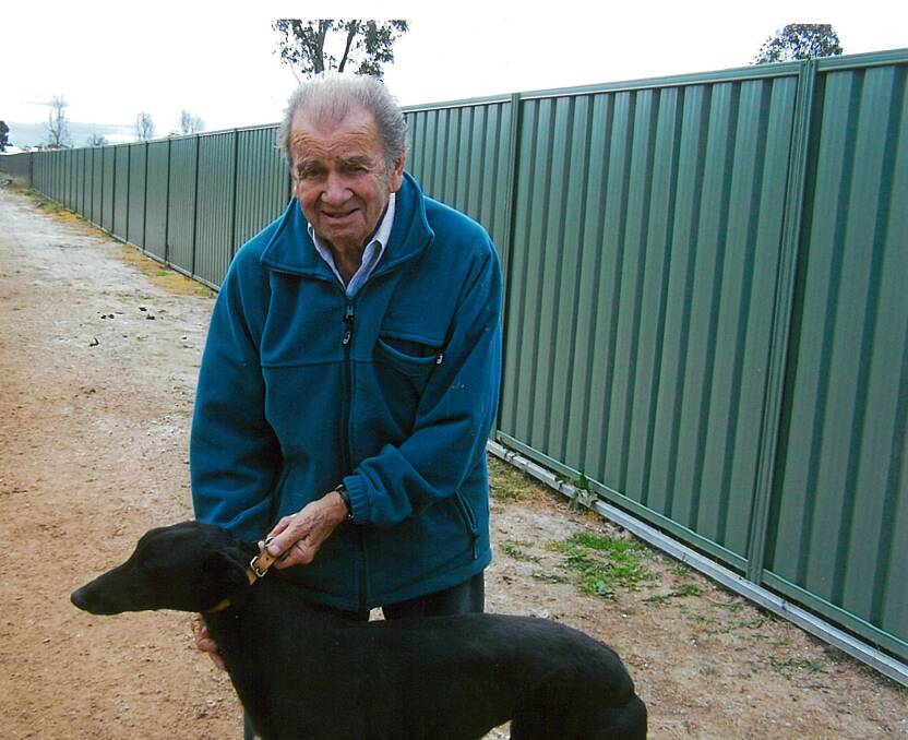 Les Dawson with one of the many greyhounds he had raced throughout the years.  
Photo: CONTRIBUTED