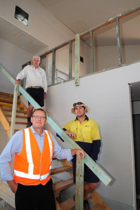 Greg Bennett and Tim Wright from BLD Constructions with WorkCover Dubbo district co-ordinator Mark Smith at the safety launch in Dubbo yesterday. 			   Photo: Belinda Soole