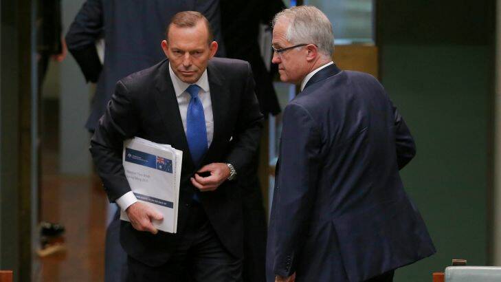 Prime Minister Tony Abbott and Communications Minister Malcolm Turnbull depart at the end of Question Time, just before a leadership spill was call, at Parliament House in Canberra on Monday 14 September 2015. Photo: Alex Ellinghausen Photo: Alex Ellinghausen