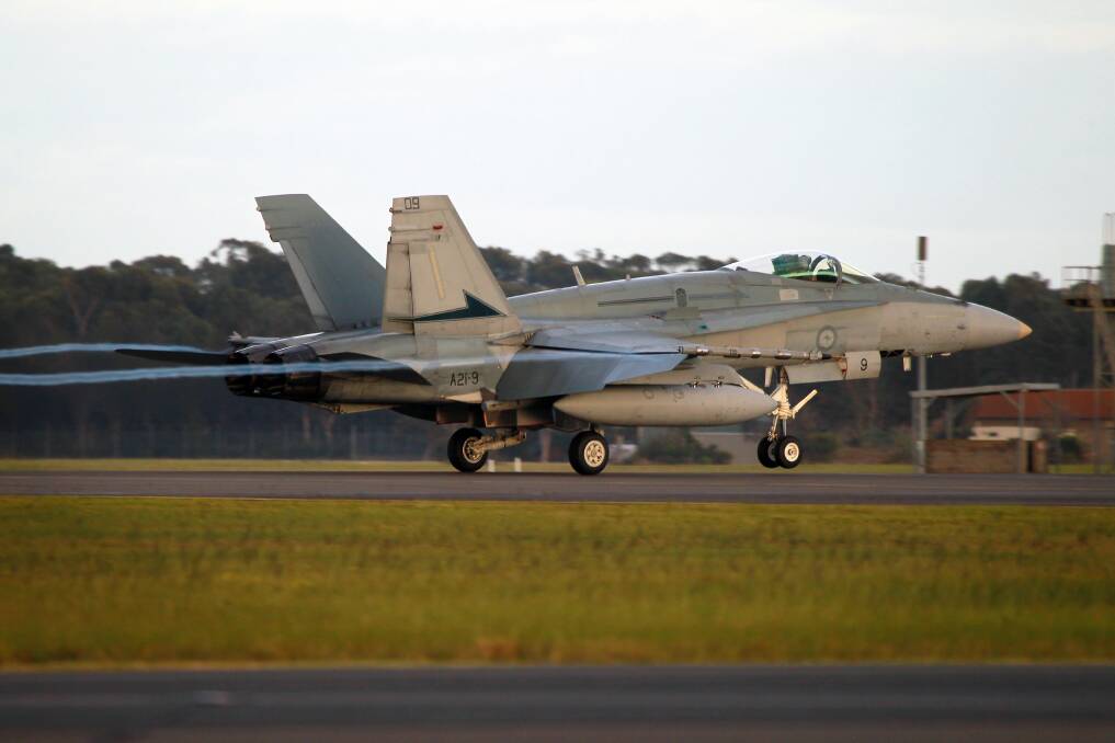 An F/A-18A Hornet lands at RAAF Base Williamtown. 	    Photo: RAAF