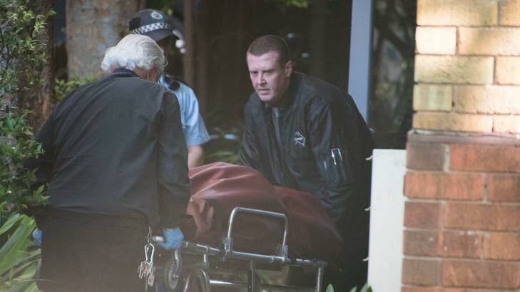 Ms Abek's body is taken away from a unit on  St Neot Avenue, Potts Point on Thursday.  Photo: Christopher Pearce