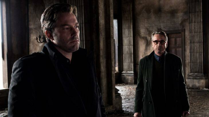 Dark and leaden .. Ben Affleck, left, as Bruce Wayne and Jeremy irons as Alfred in <i>Batman v Superman: Dawn of Justice</i>