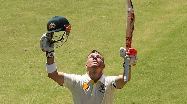 David Warner salutes the heavens in honour of fallen friend Phillip Hughes after scoring his 10th Test century. Photo: Getty Images 