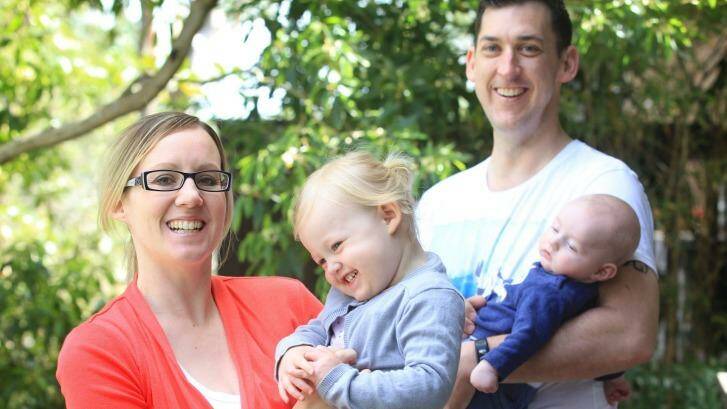 Kate Wild with her children Poppy (aged 2) and William (aged 3 months) and her husband Brendon at their Westleigh home. Photo: James Alcock