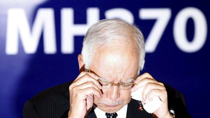 Malaysia's Prime Minister Najib Razak adjusts his glasses before speaking. Photo: Reuter