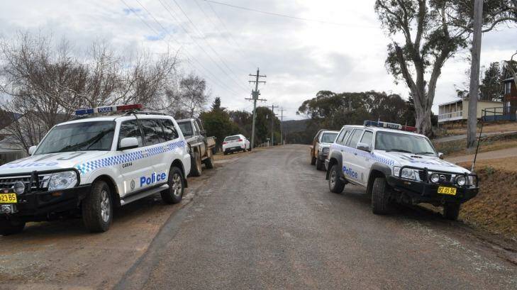 Police cars outside a house in Anglers Reach which was destroyed by a fire that claimed the life of a four-year-old boy. Photo: Nathan Thompson, Cooma-Monaro Express